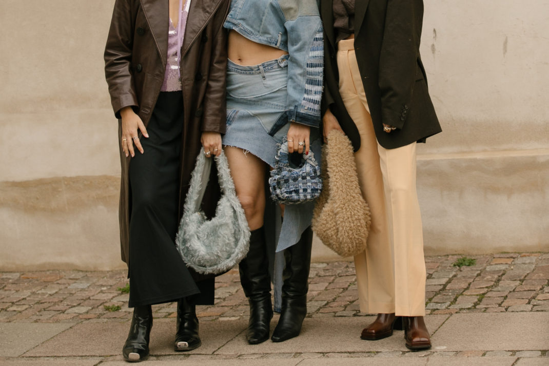 Close up of people's outfits with knee high boots
