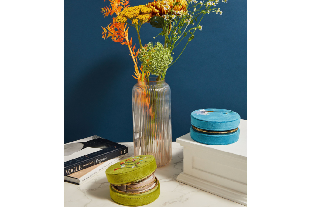 Jewellery boxes by vase of flowers