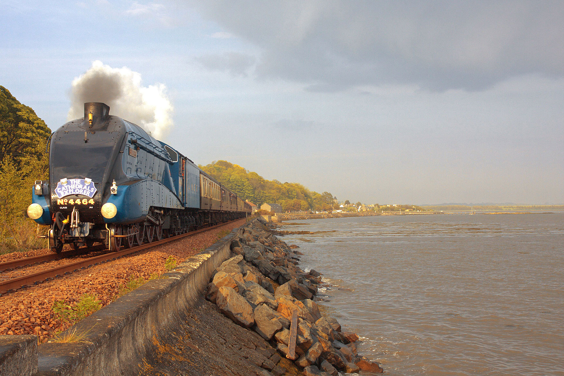 Train travelling by the British sea