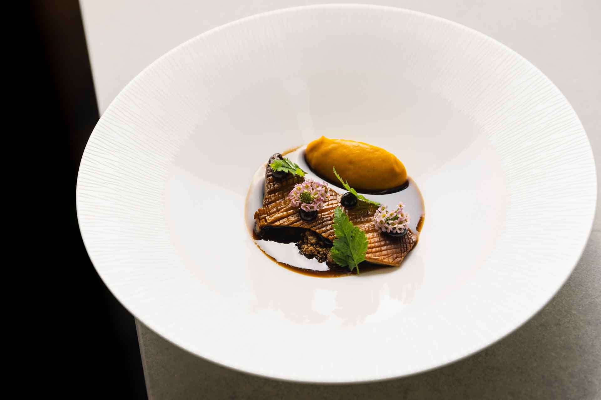 Lamb dish with jus and micro herbs