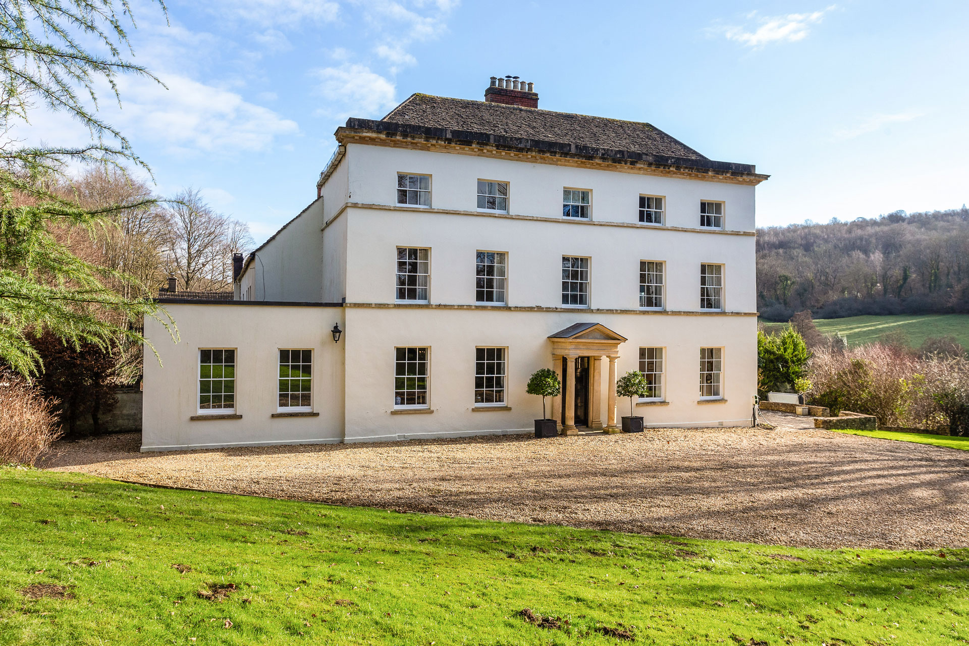 Georgian country home with fields surrounding it