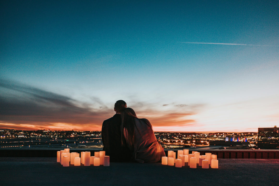 Couple watching the sunset together | date night outfits