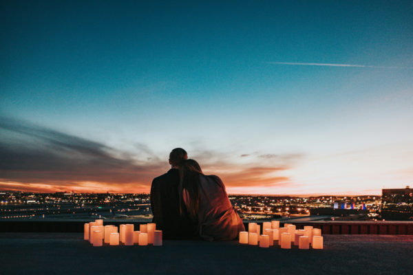 Couple watching the sunset together | date night outfits