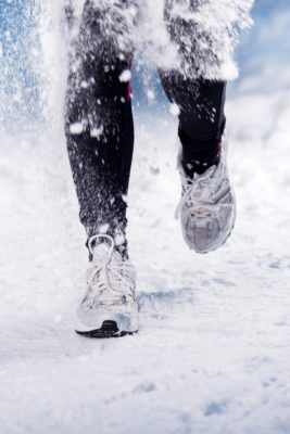 Person running in show | outdoor exercise winter