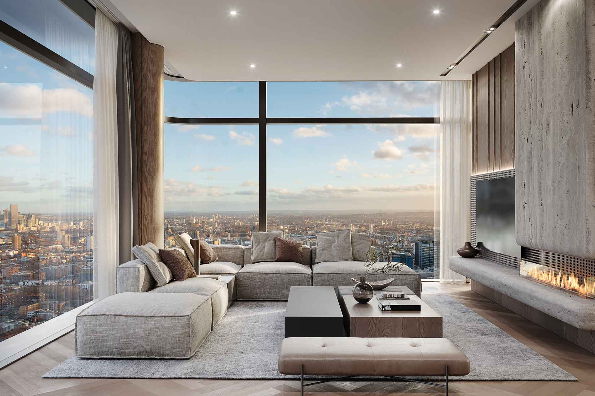 Living room with cream modular sofa, fireplace, and floor-to-ceiling windows overlooking Shoreditch.