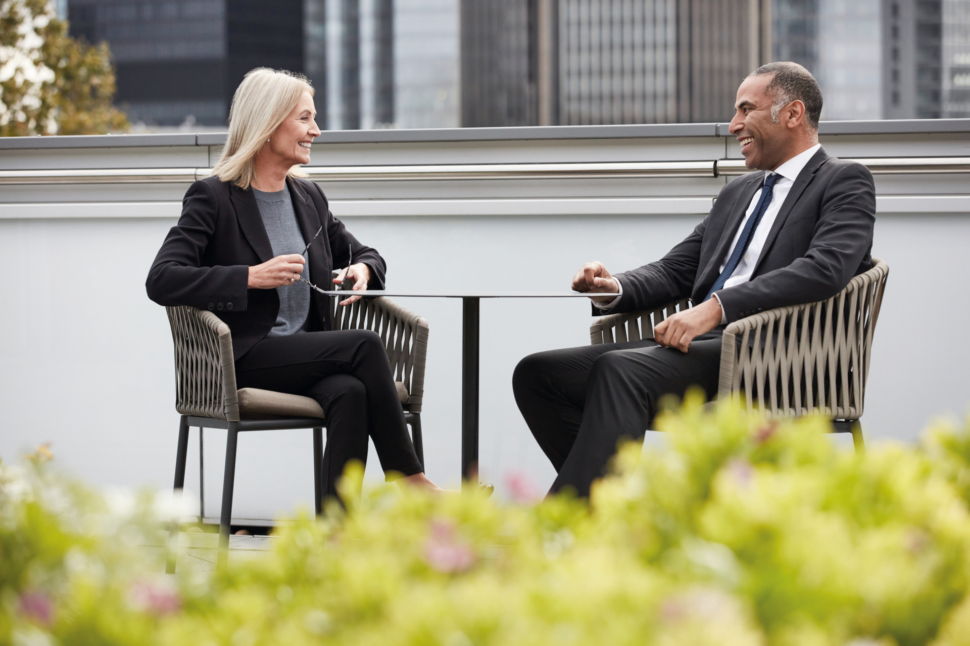 Woman on man sat on chairs together