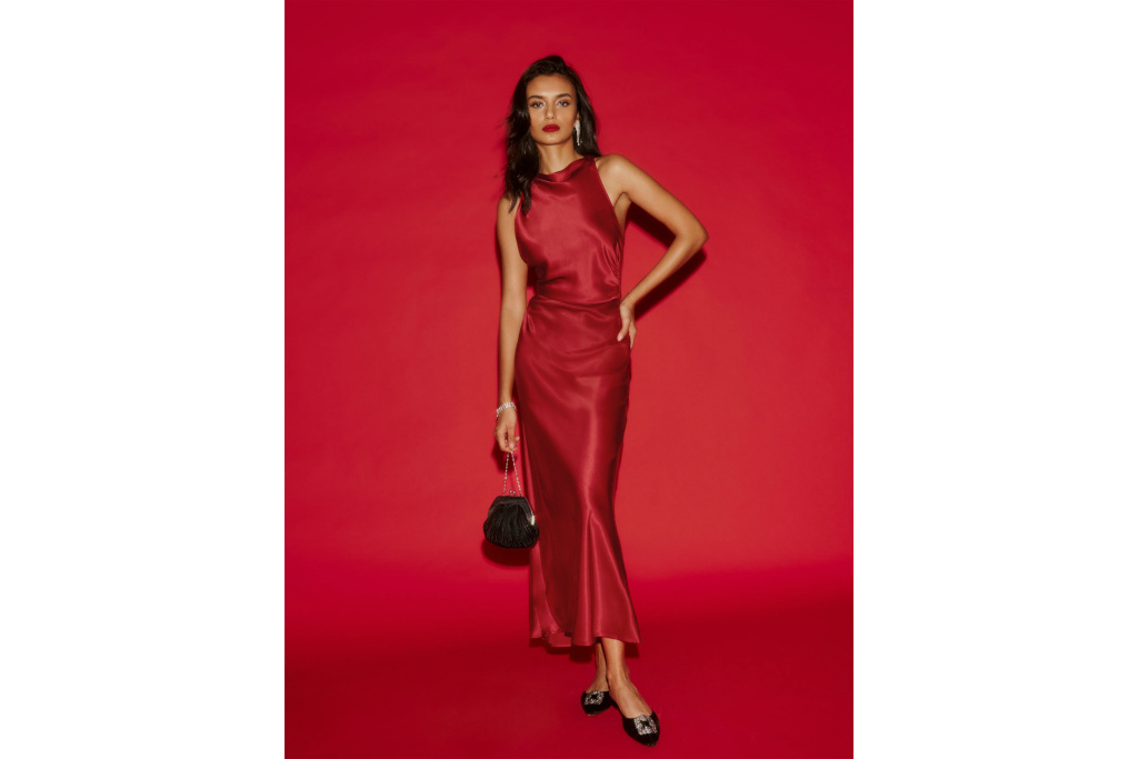 Woman in red dress on red background