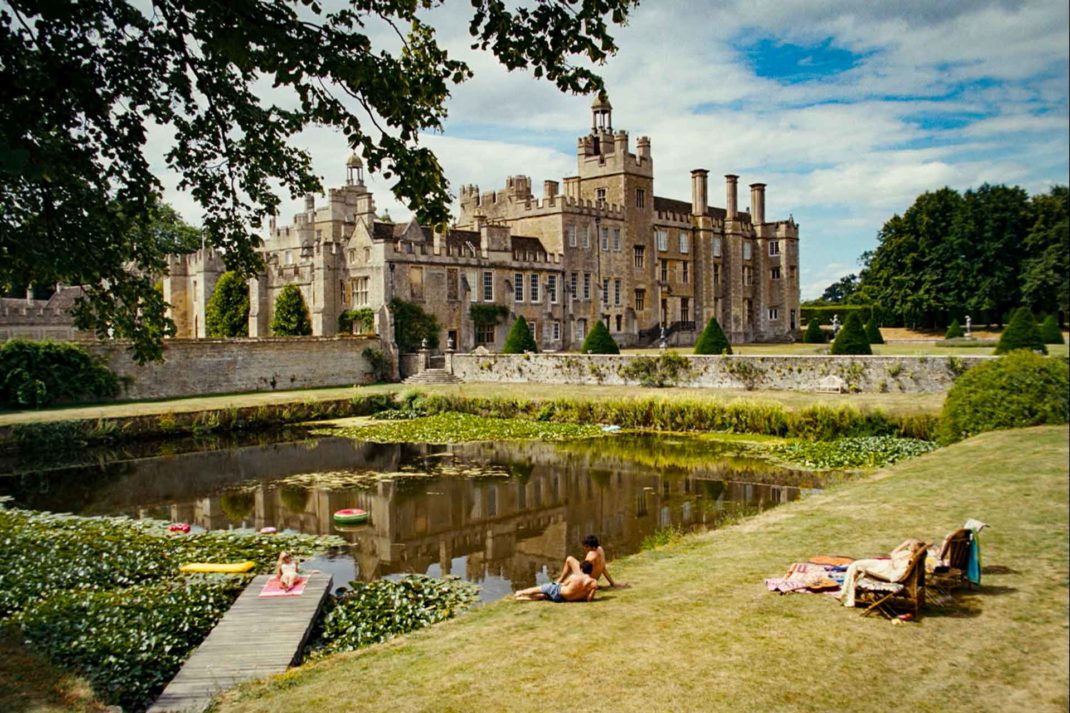 Exterior of the country mansion in Saltburn, with a pond in the foreground