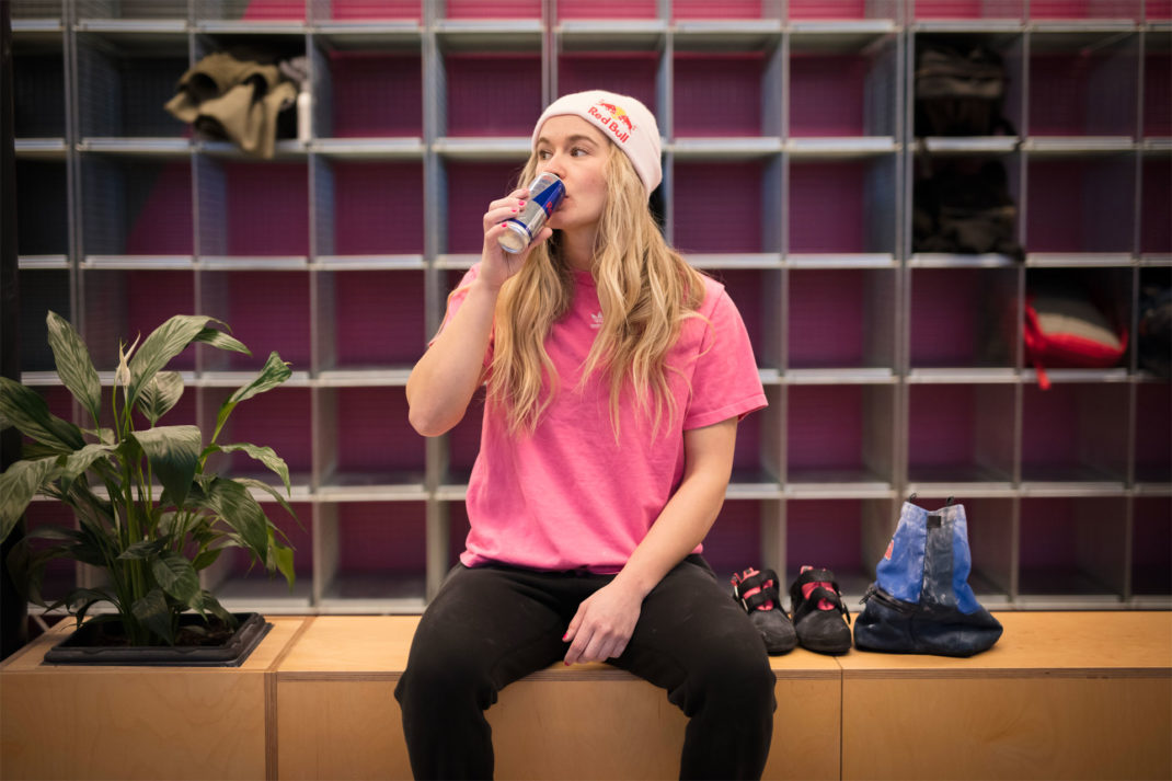 Climber Shauna Coxsey sat drinking a red bull