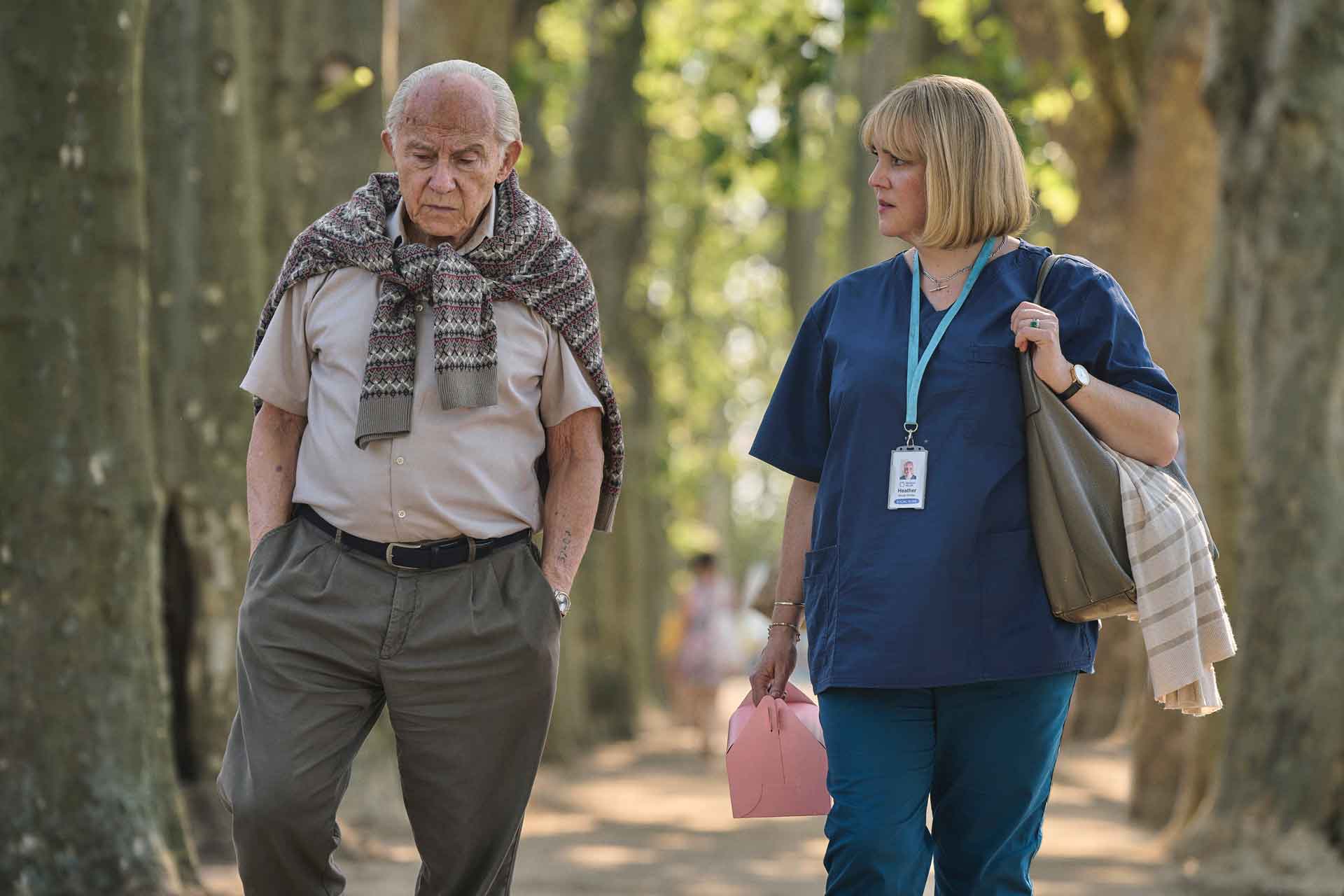 Harvey Keitel as Lali Sokolov and Melanie Lynskey as Heather Morris walking through the streets of Melbourne.