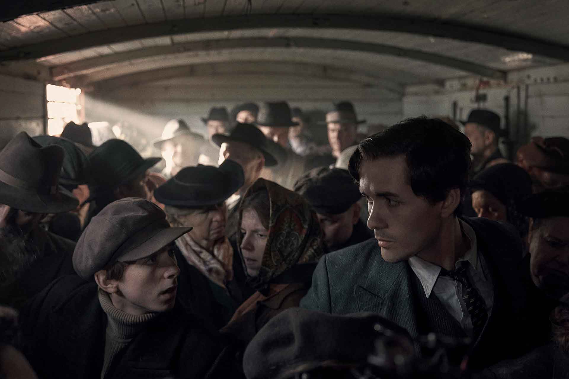 Jonah Hauer-King playing Lali Sokolov, boarding the train to Auschwitz