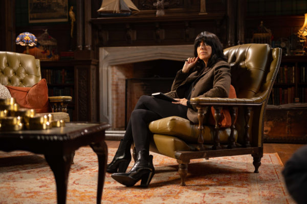 Claudia Winkleman sat on armchair in study