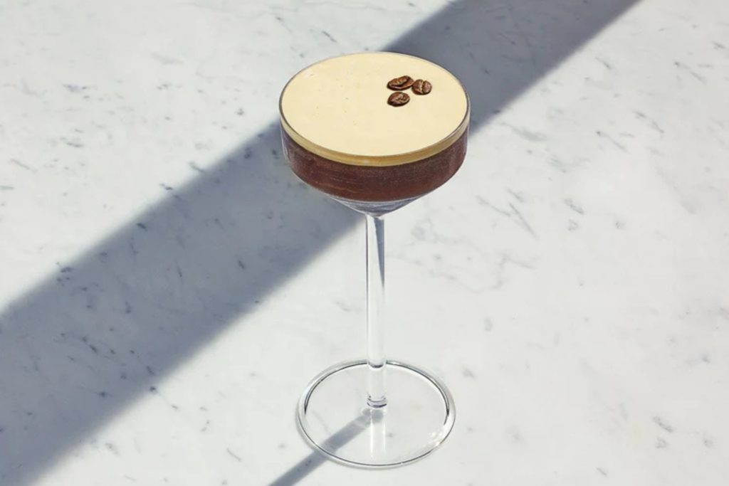 Espresso martini in glass on marble counter