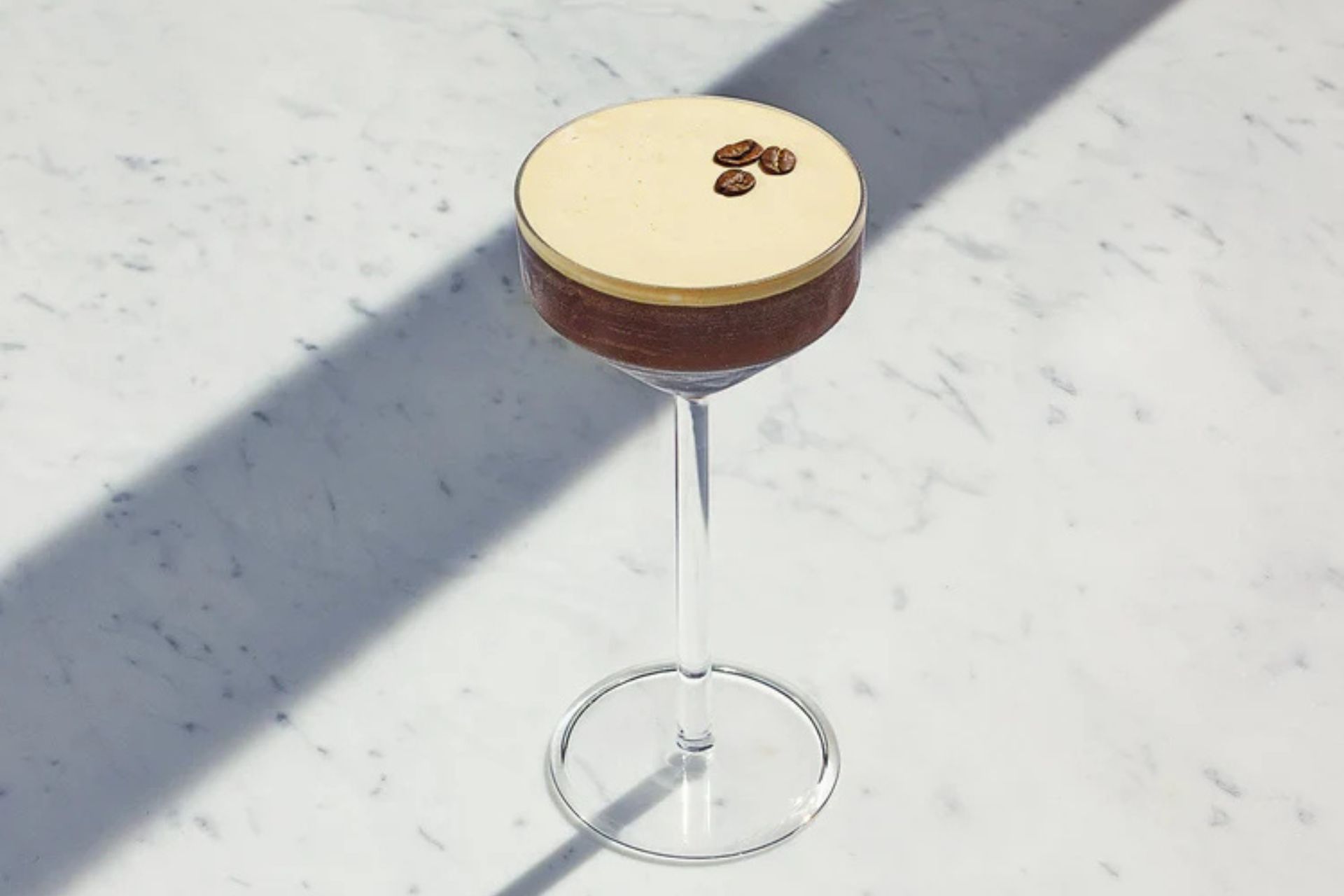 Espresso martini in glass on marble counter