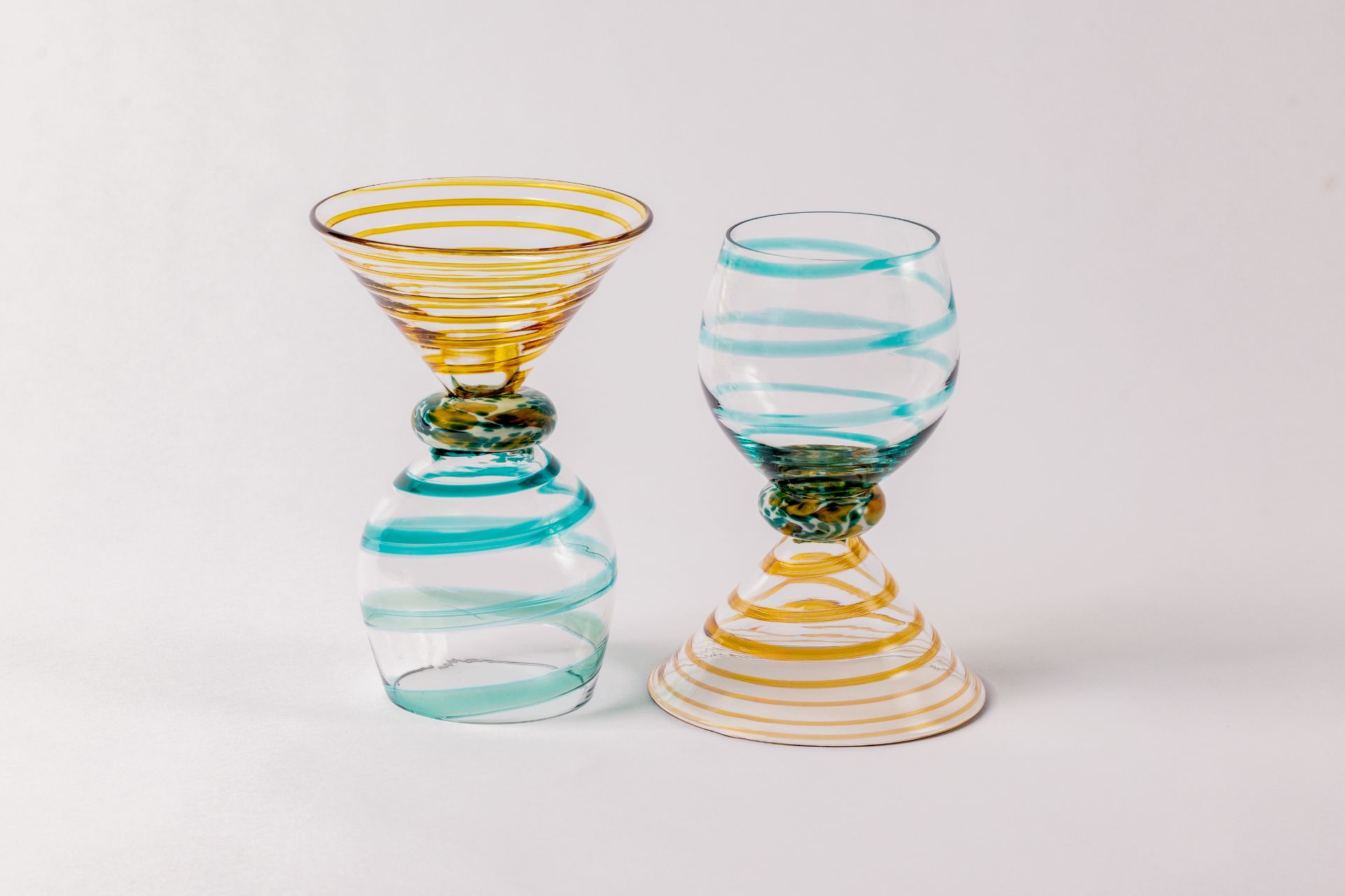 Cocktail glasses with yellow and blue swirl design