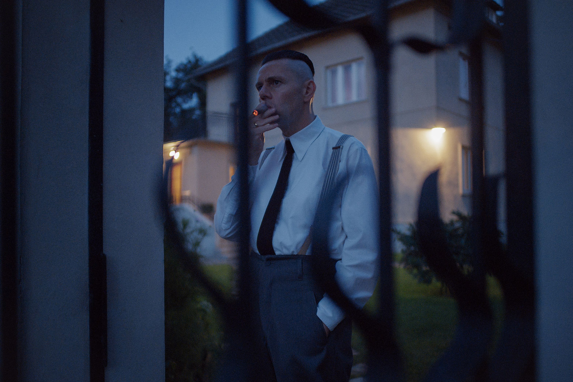 A man smoking a cigarette in The Zone of Interest