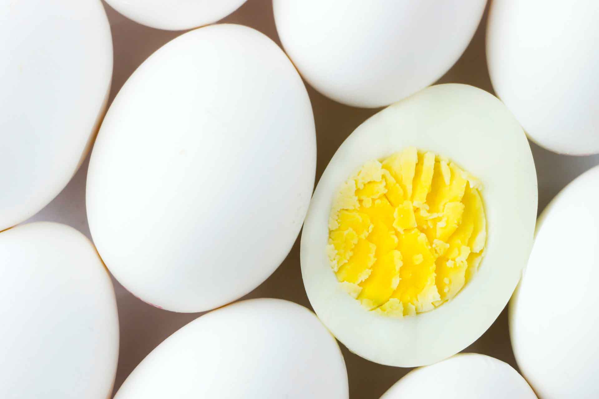 hard boiled egg surrounded by white eggs