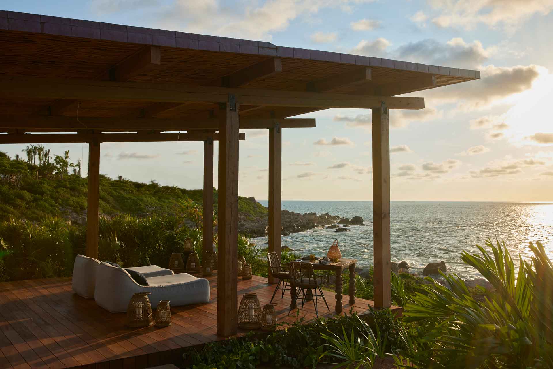 Terrace at Naviva resort in Mexico, overlooking the ocean.