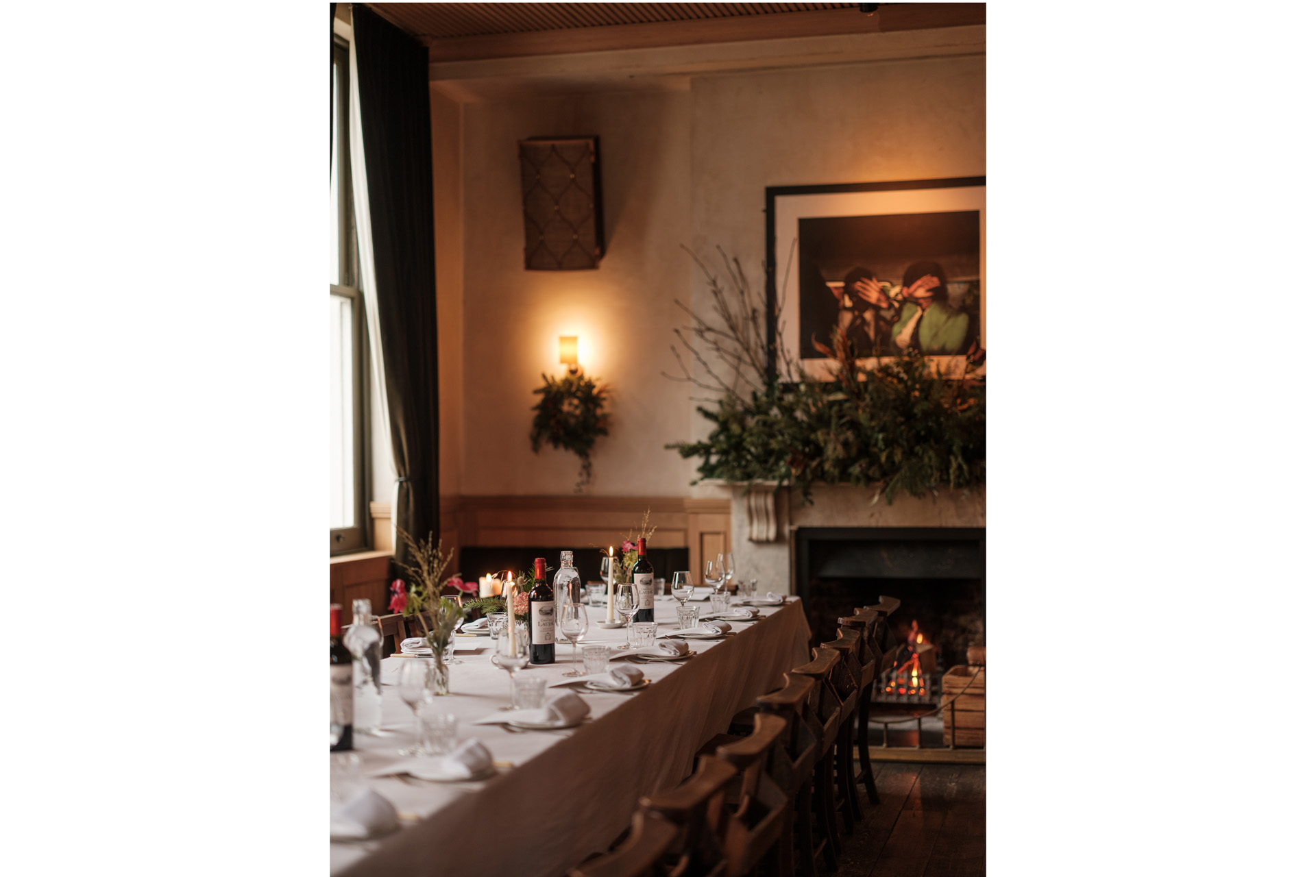 A dinner table beside a mantlepiece