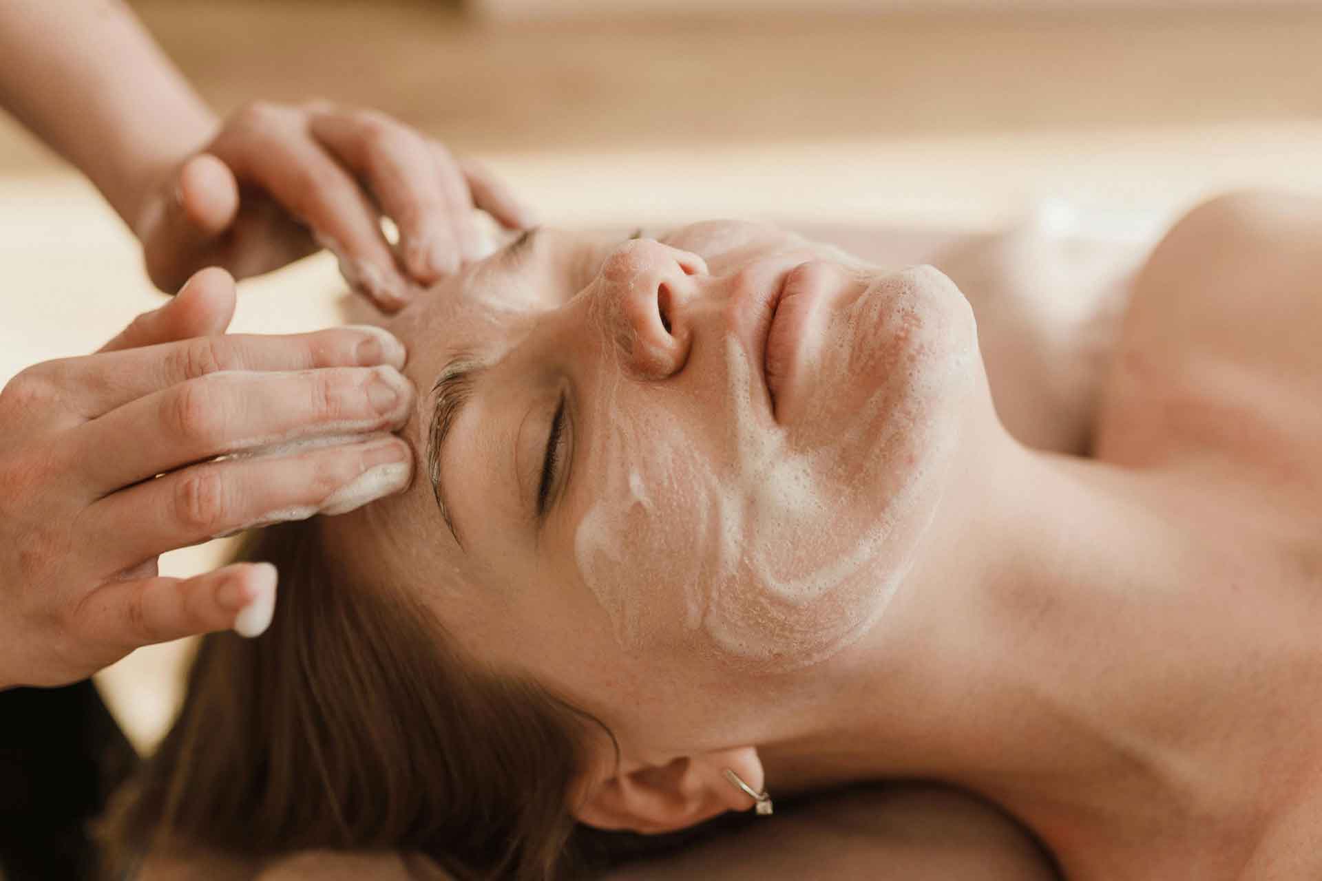 women receiving facial treatment