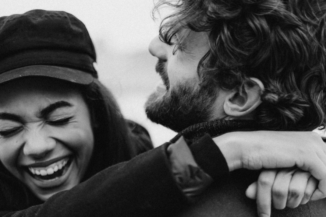Two people embracing and laughing