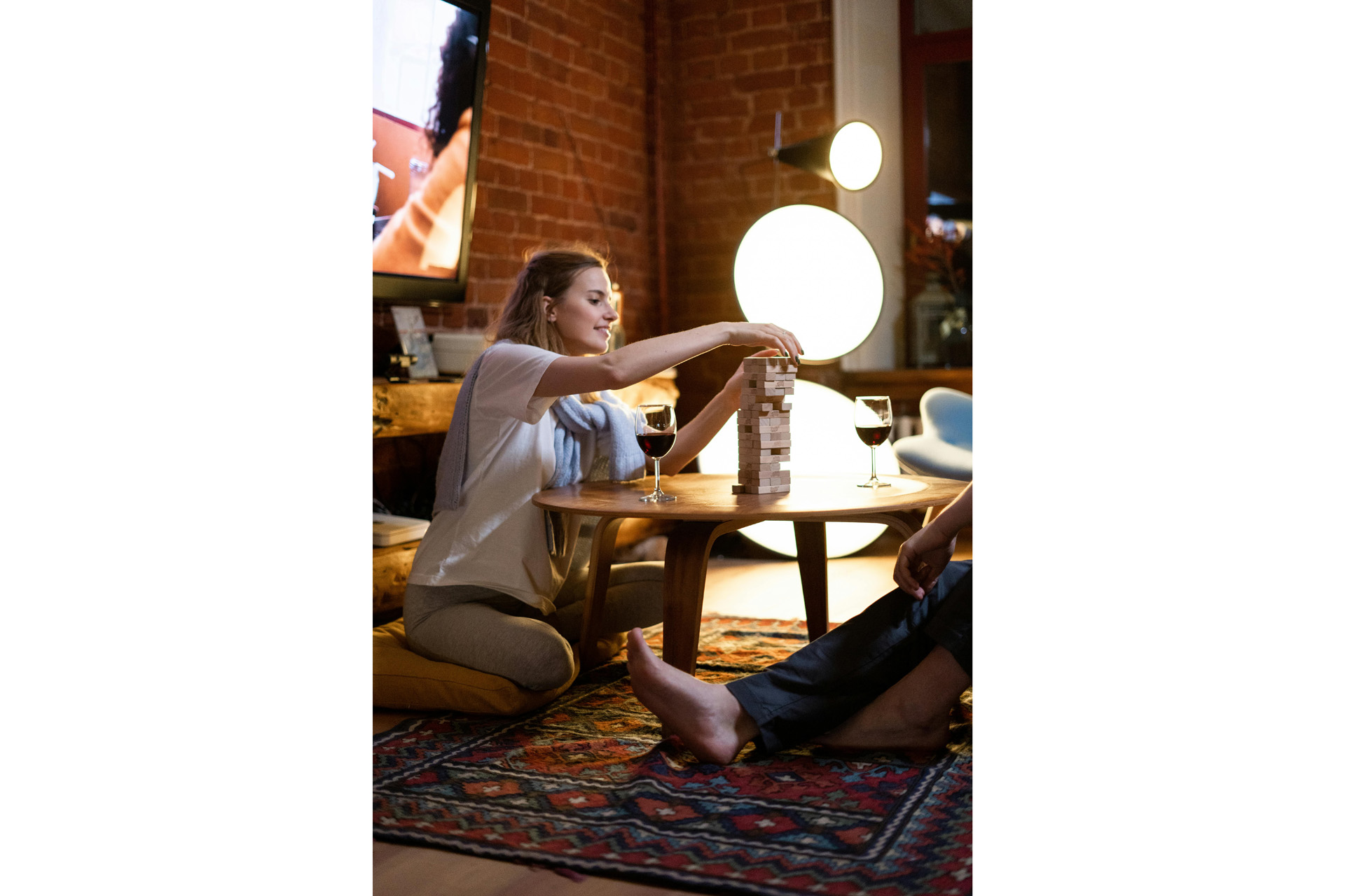 A woman at home playing jenga