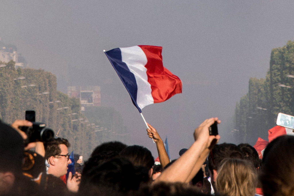 A French flag being flown