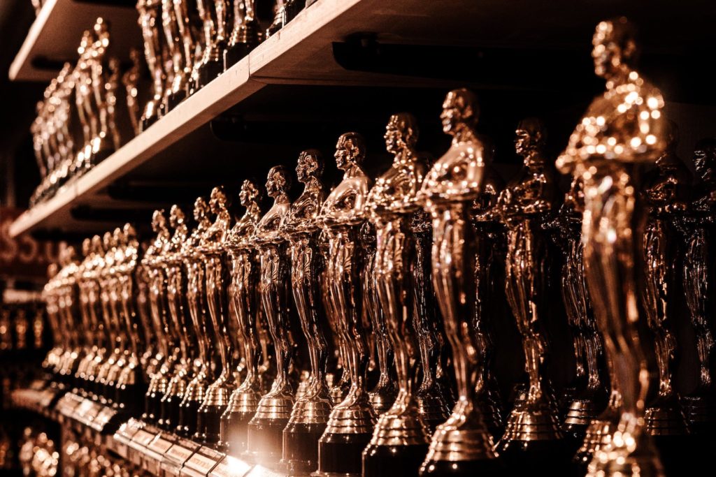 Gold awards figurines on a shelf for Great British Brands Awards 2024