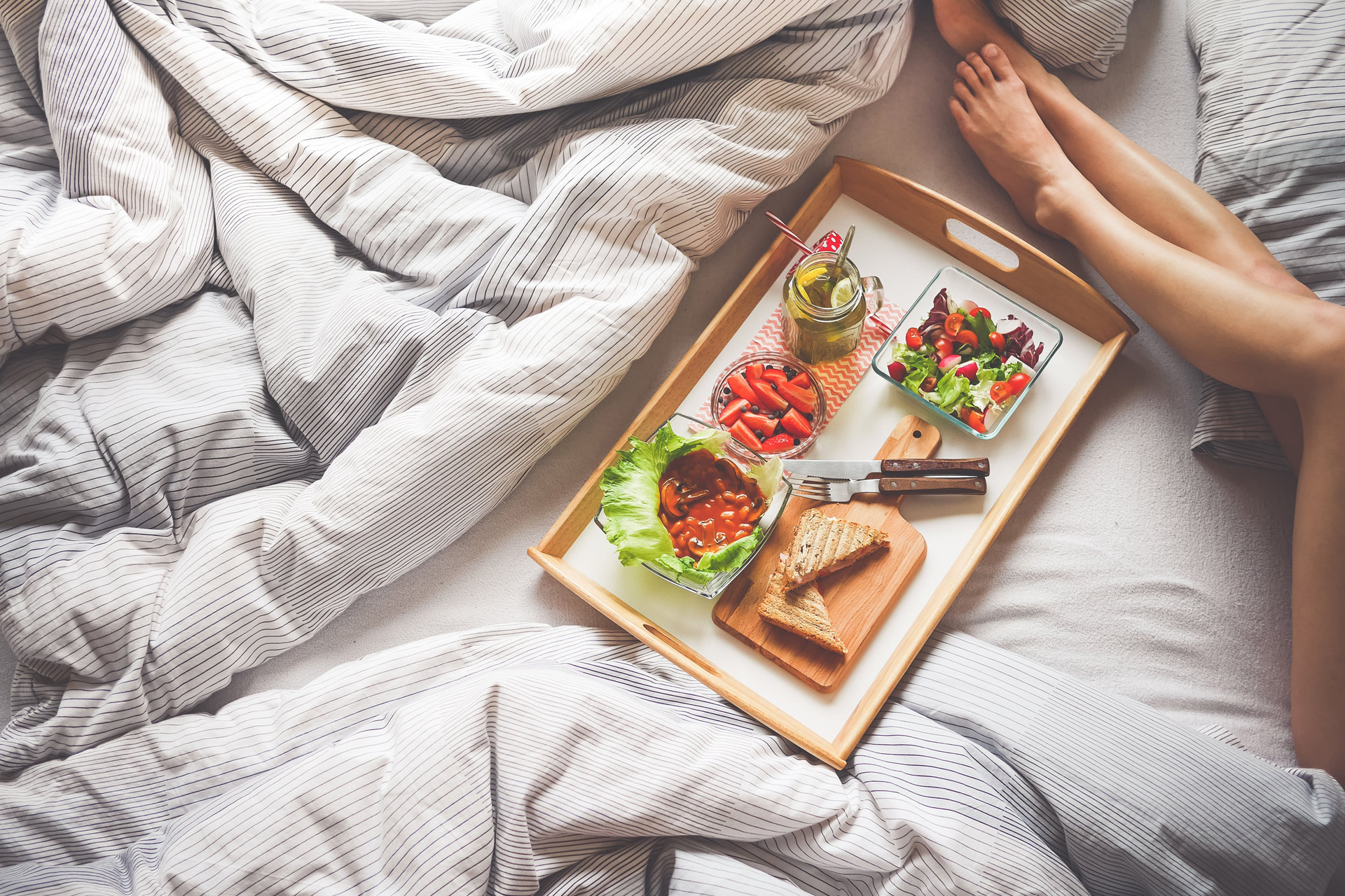 Vegan food on a tray in bed