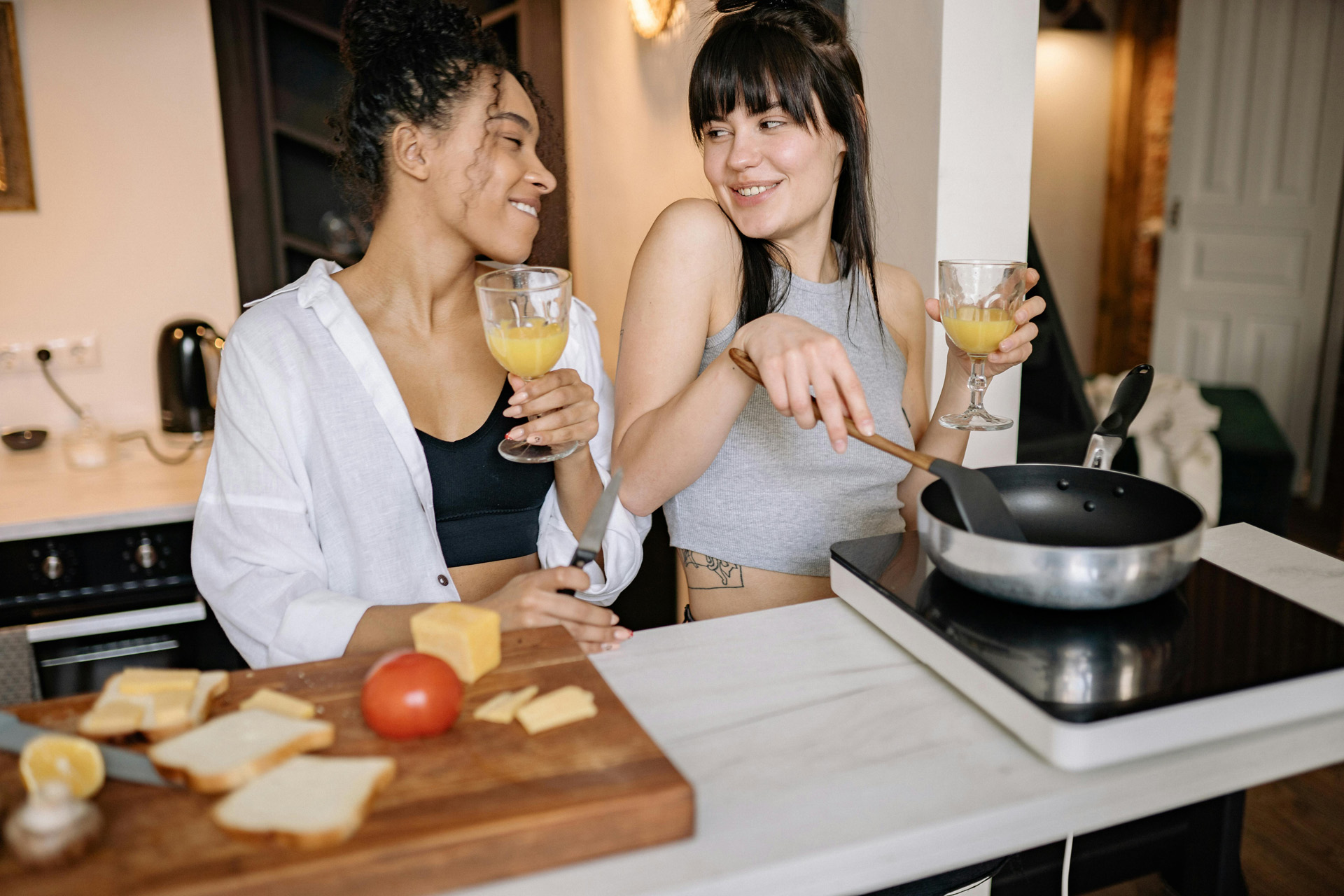 Two people cooking at home