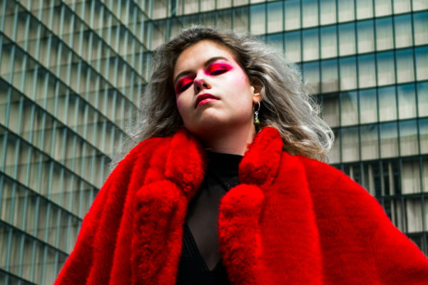 Woman in red fluffy coat - mob wife aesthetic