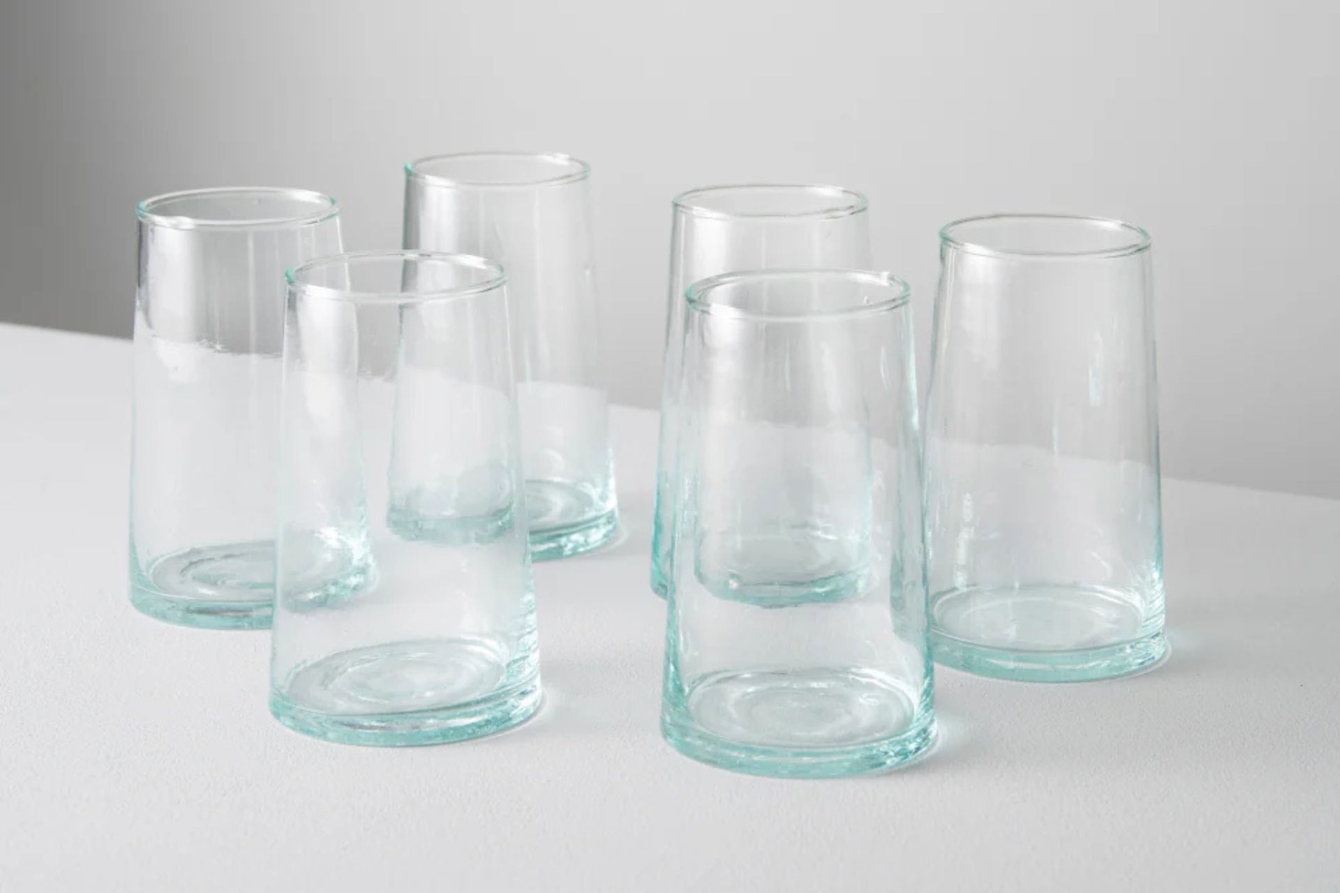 Clear highball glasses in concave shape
