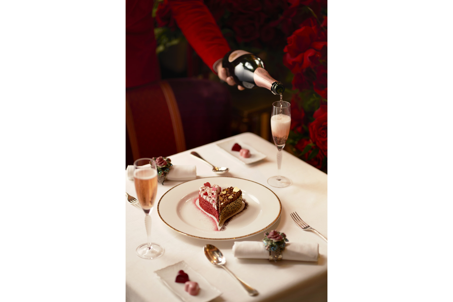 A heart shaped dessert with pink fizz