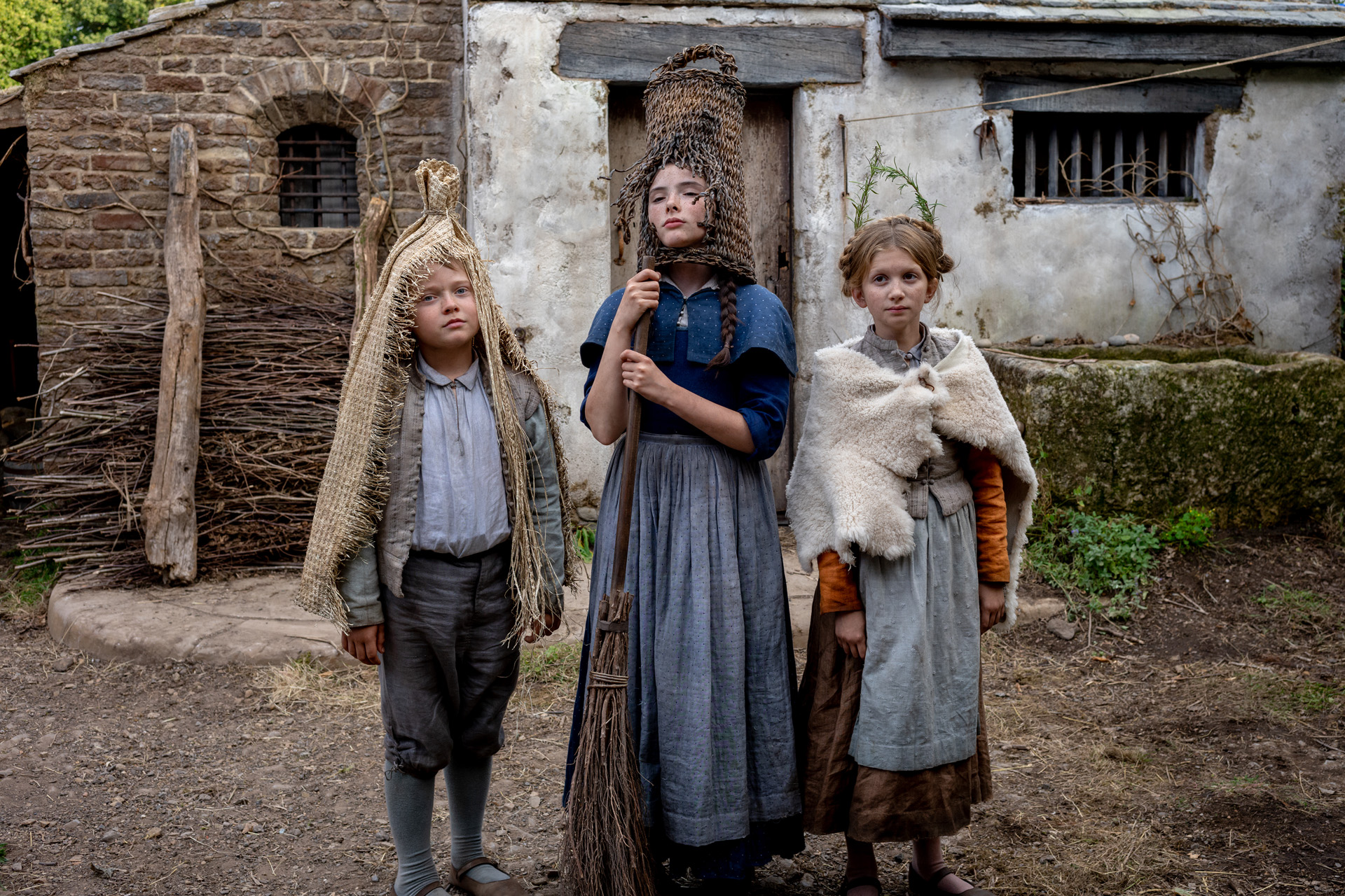 Jacobi Jupe stars as Hamnet, Bodhi Rae Breathnach as Susanna and Olivia Lynes as Judith in director Chloé Zhao’s HAMNET