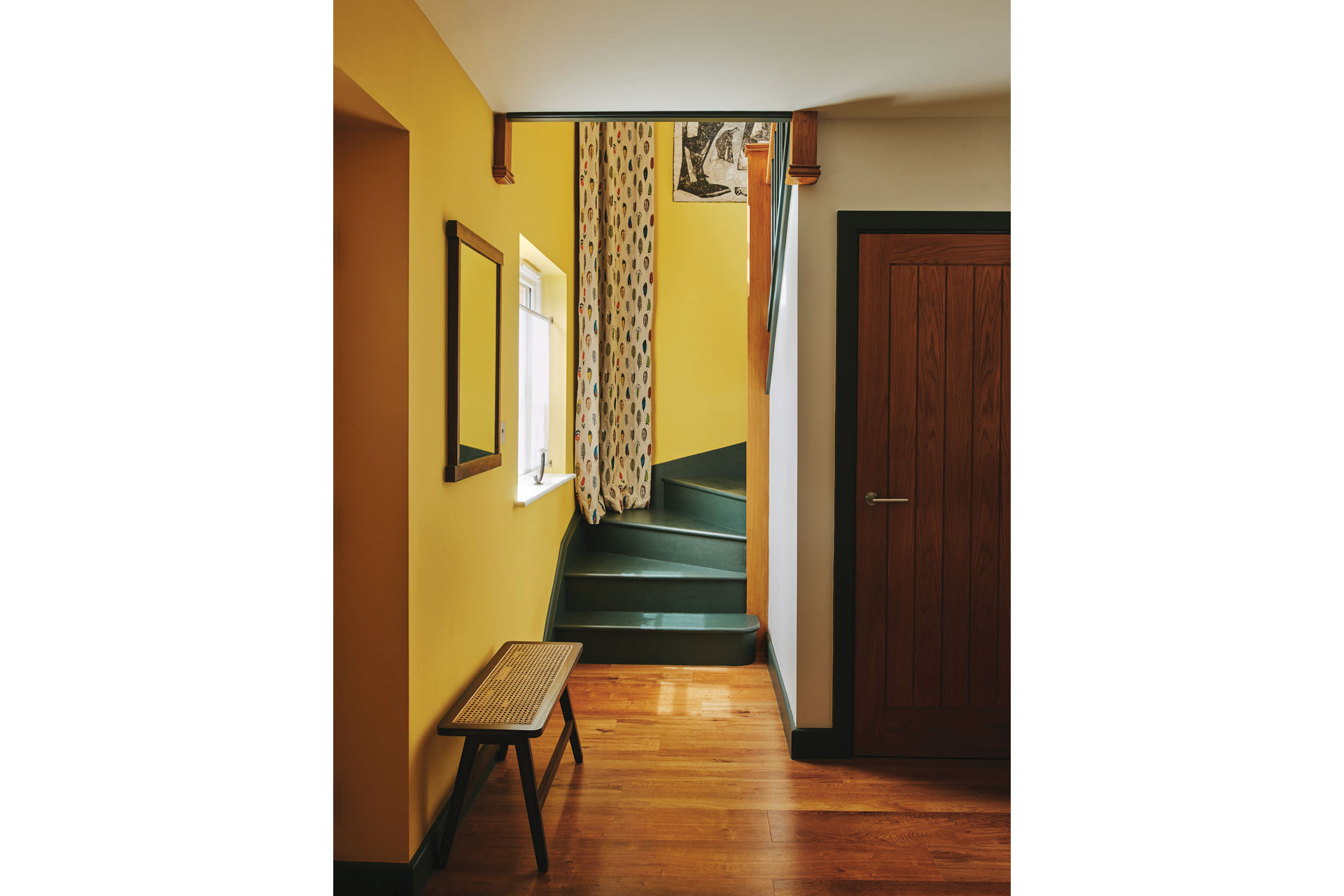 Colourful stairs in yellow hallway