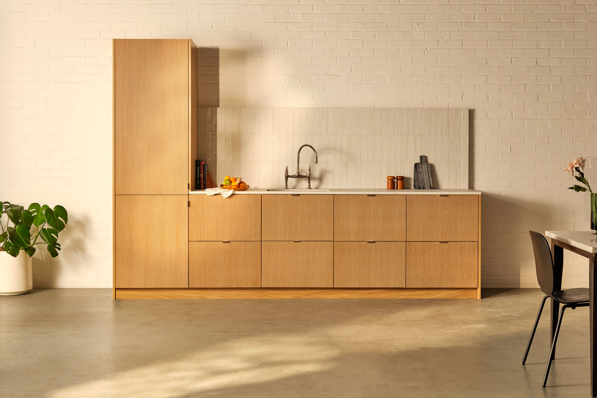 Sleek wooden kitchen with concrete floor