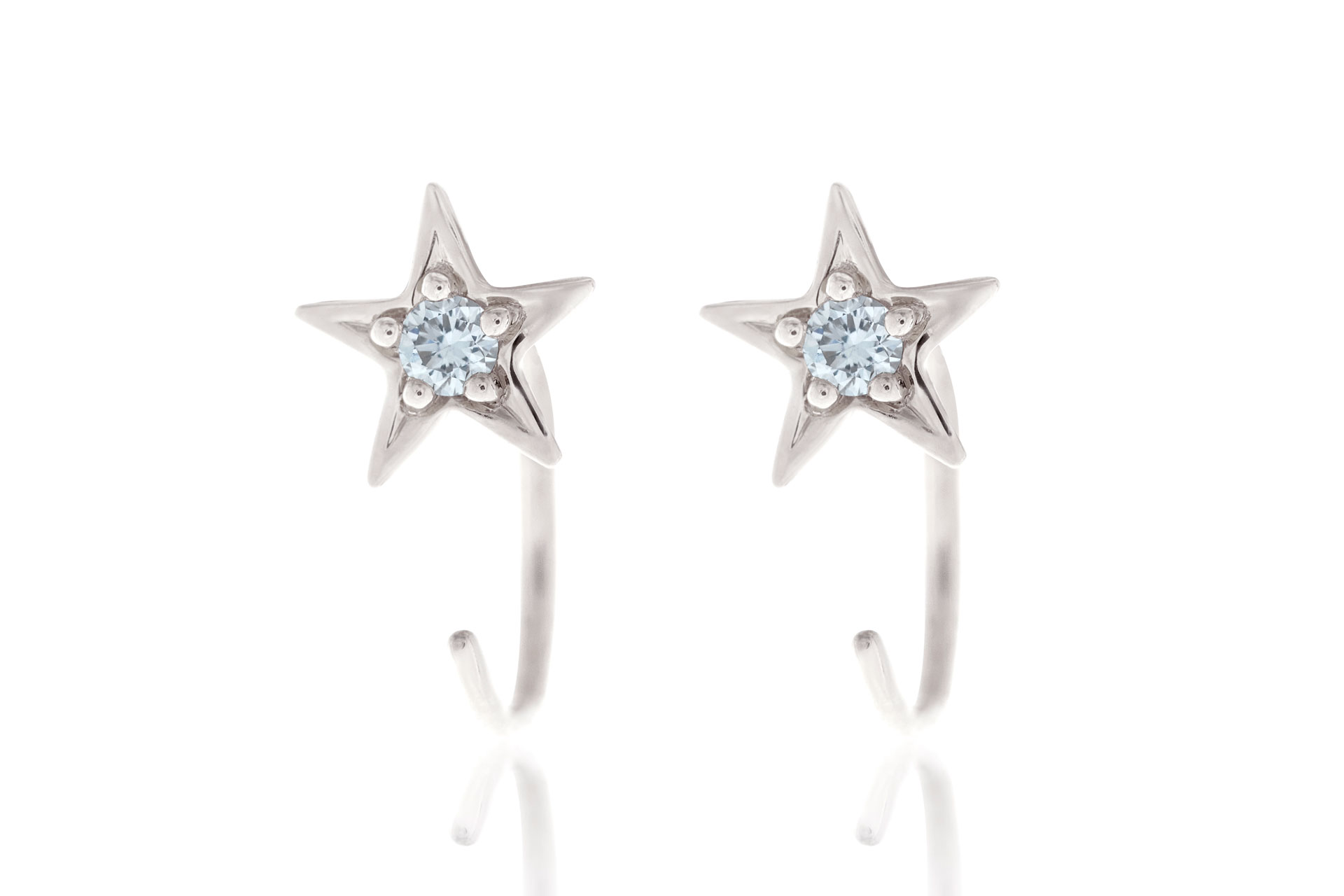 White gold hoop earrings with star design inset with diamonds.