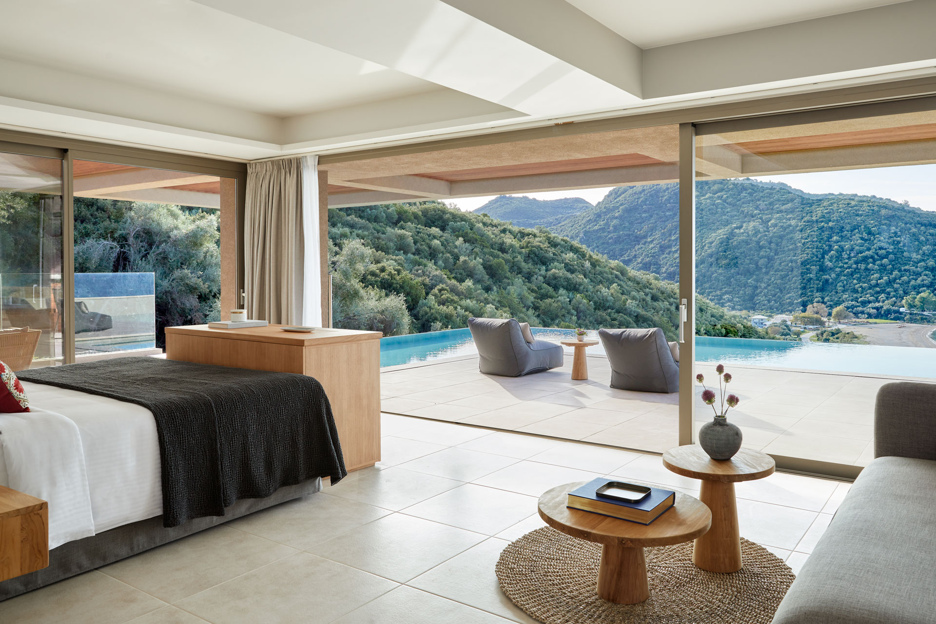 Bedroom at Elix resort, with private pool overlooking the ocean