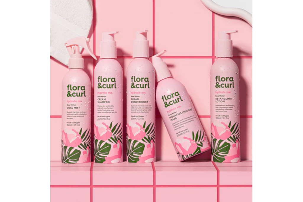 Pink bottles in front of pink tile background