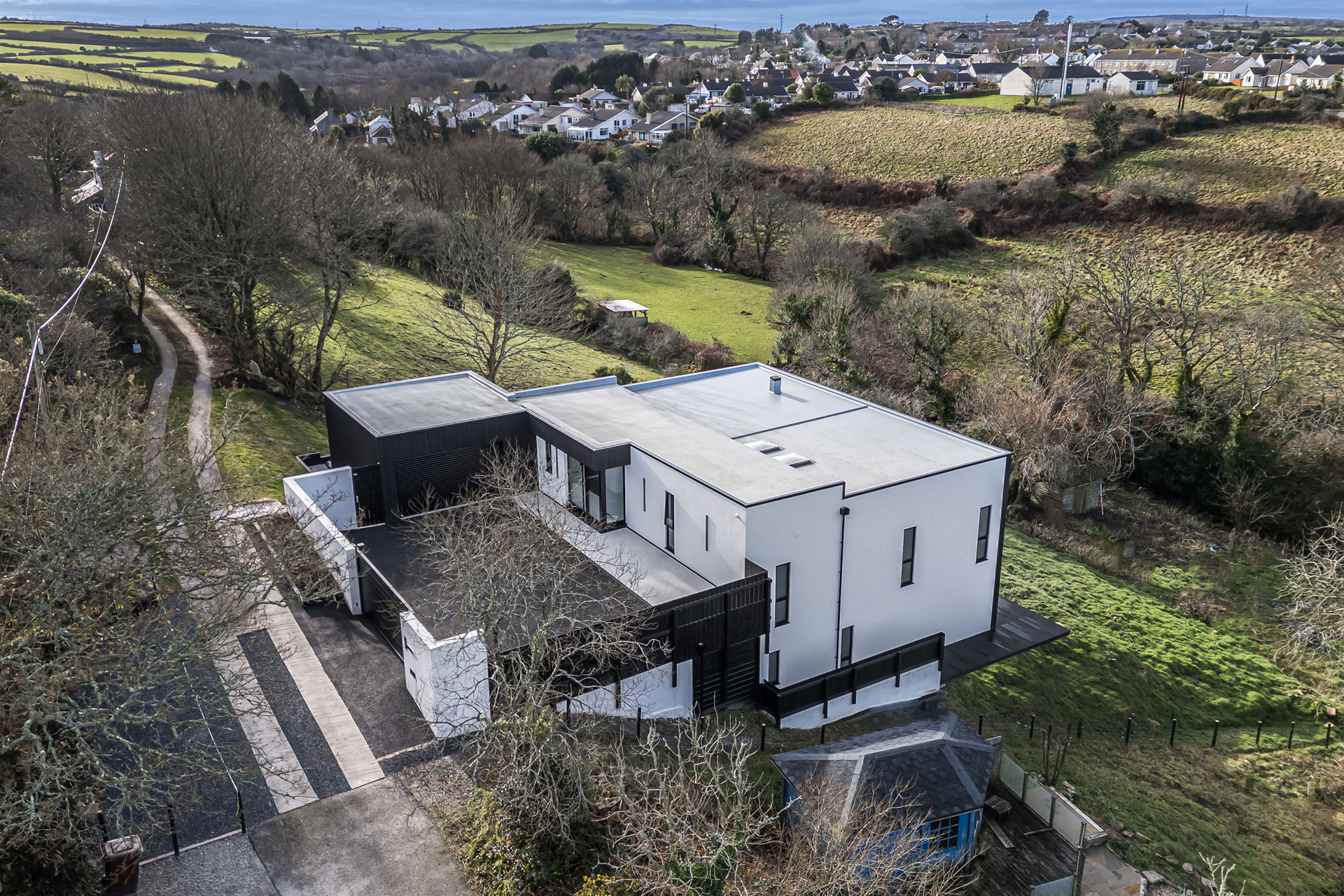 Modern eco home with white walls and black timber cladding