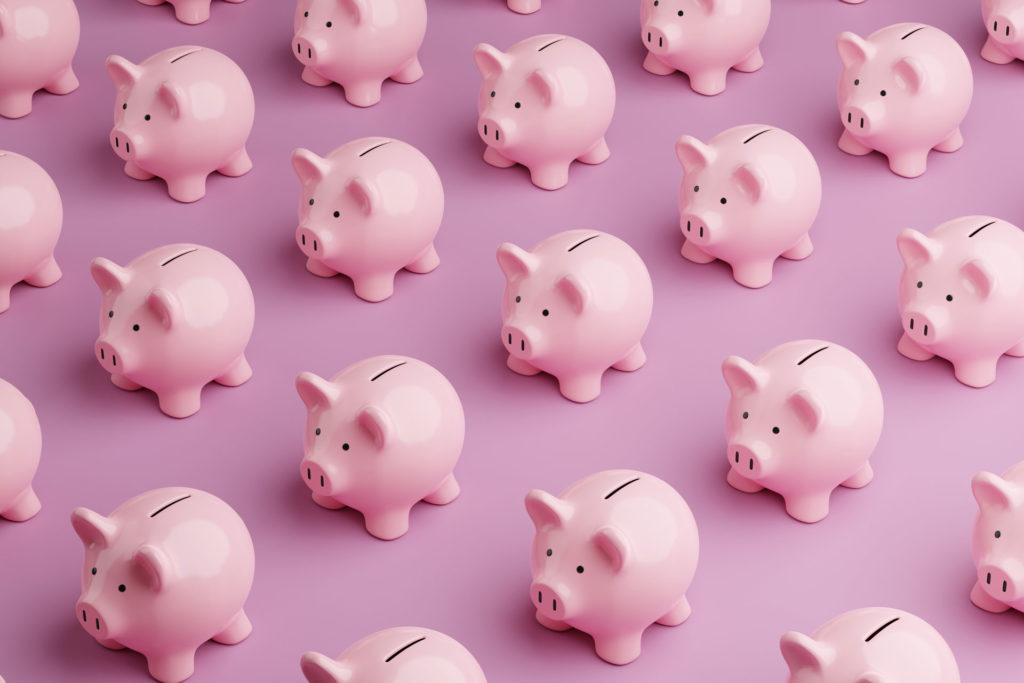 Lots of piggy banks on a pink background
