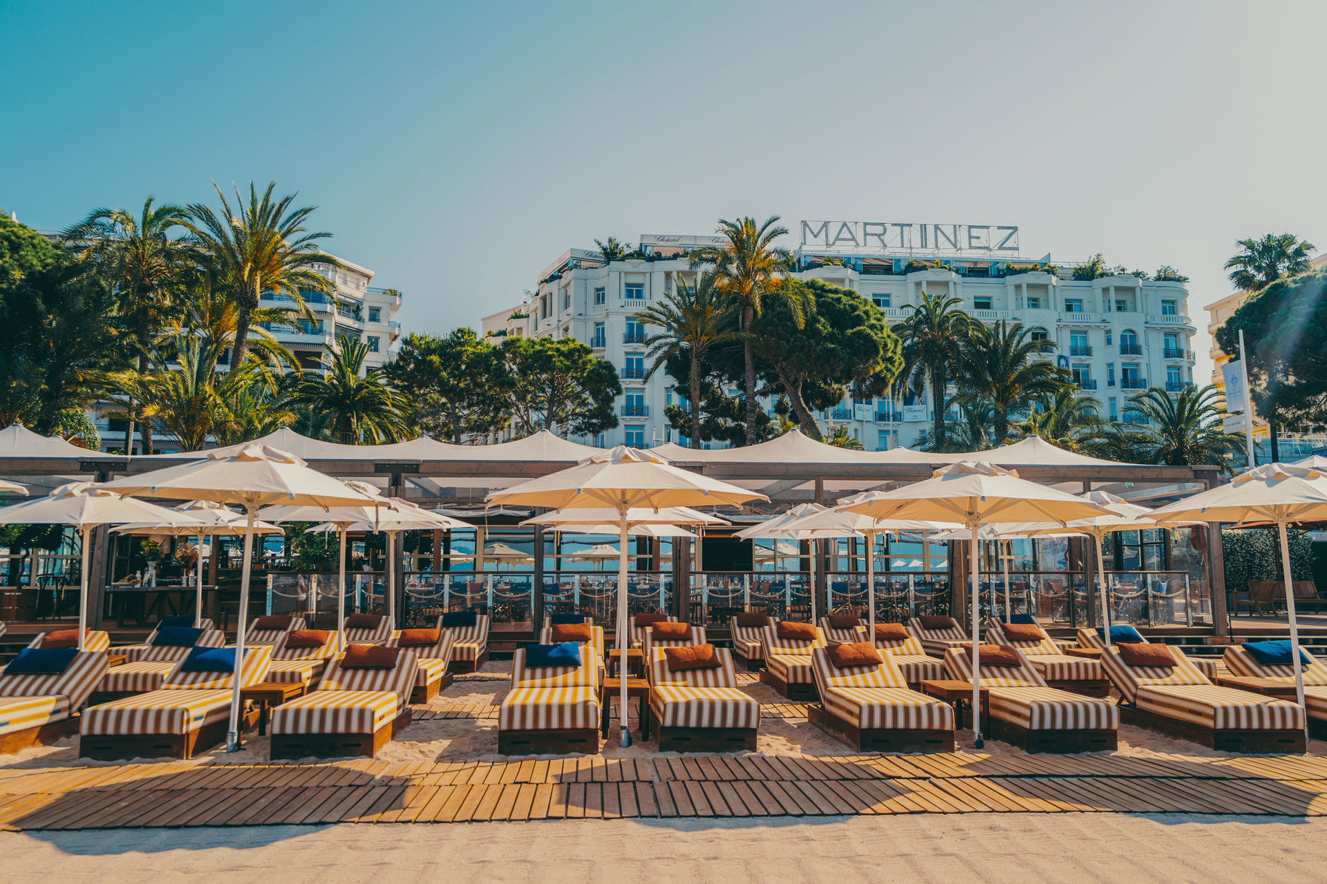 Hotel Martinez beach area, with orange striped parasols.