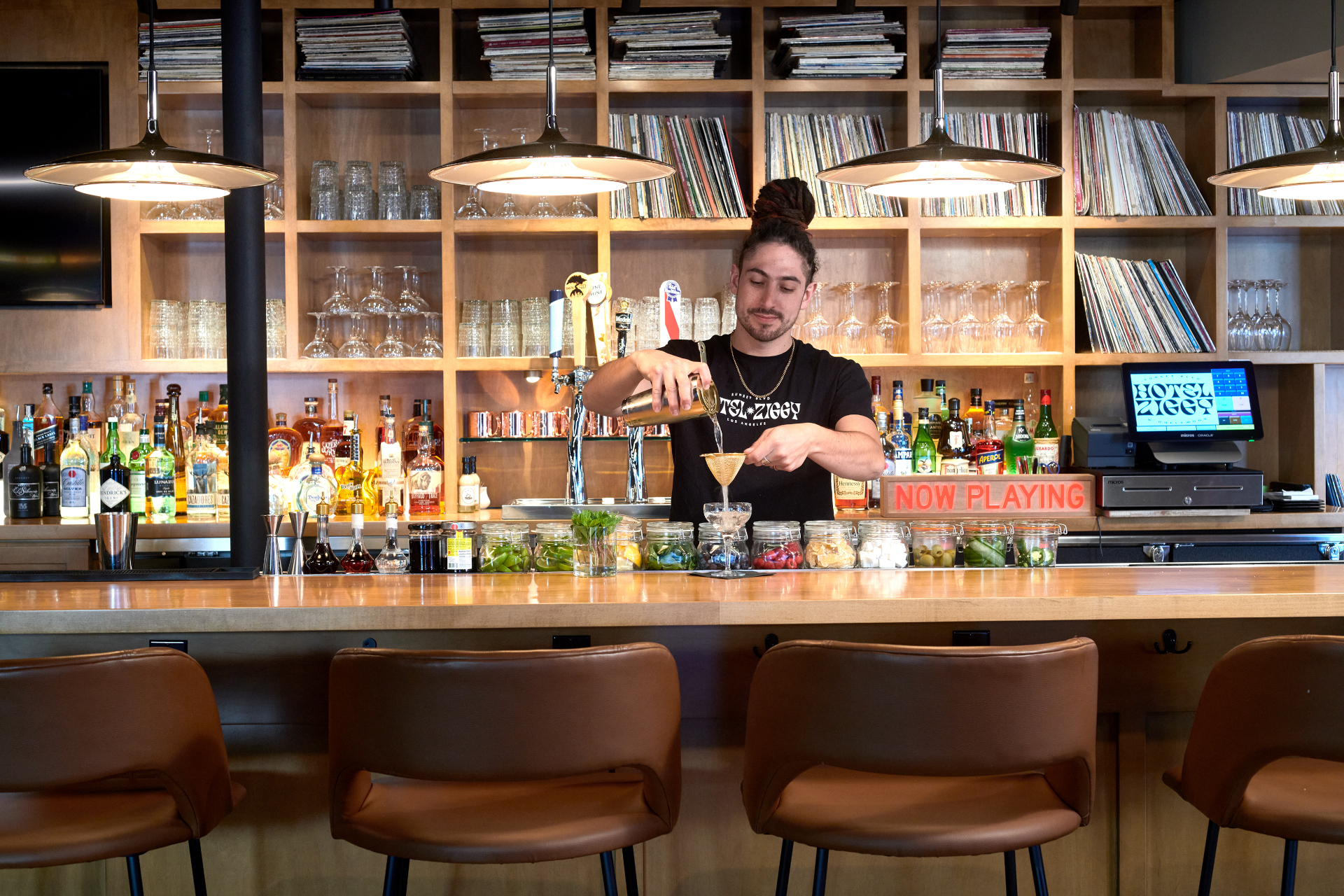 Stocked bar with barman