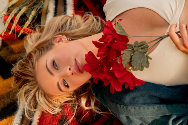 Woman lying down with champagne blonde hair