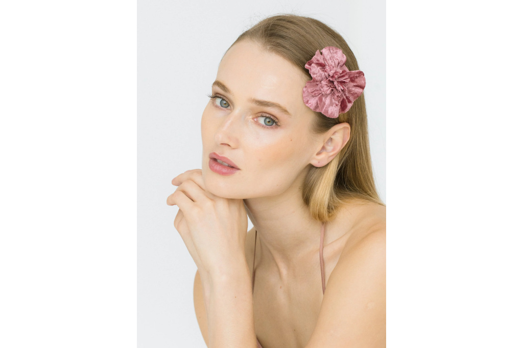 Woman wearing pink floral hair clip