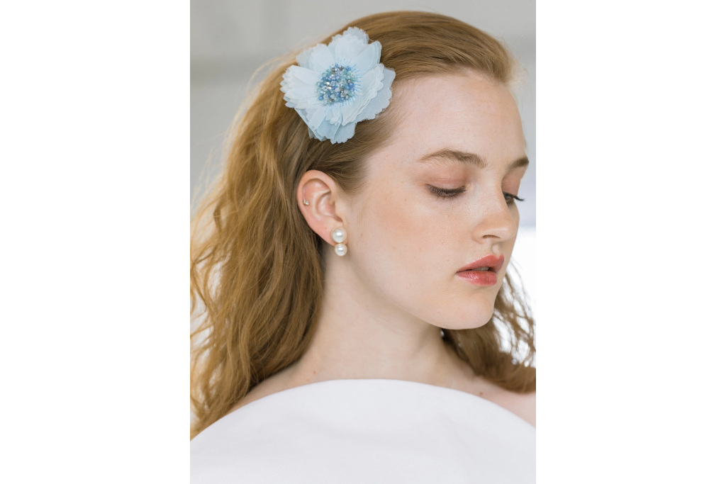 Woman with blue floral hair clip