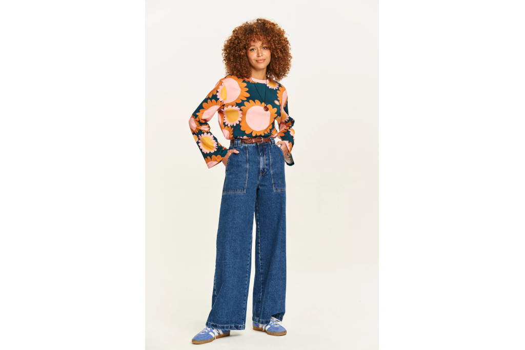 Woman in patterned shirt and jeans