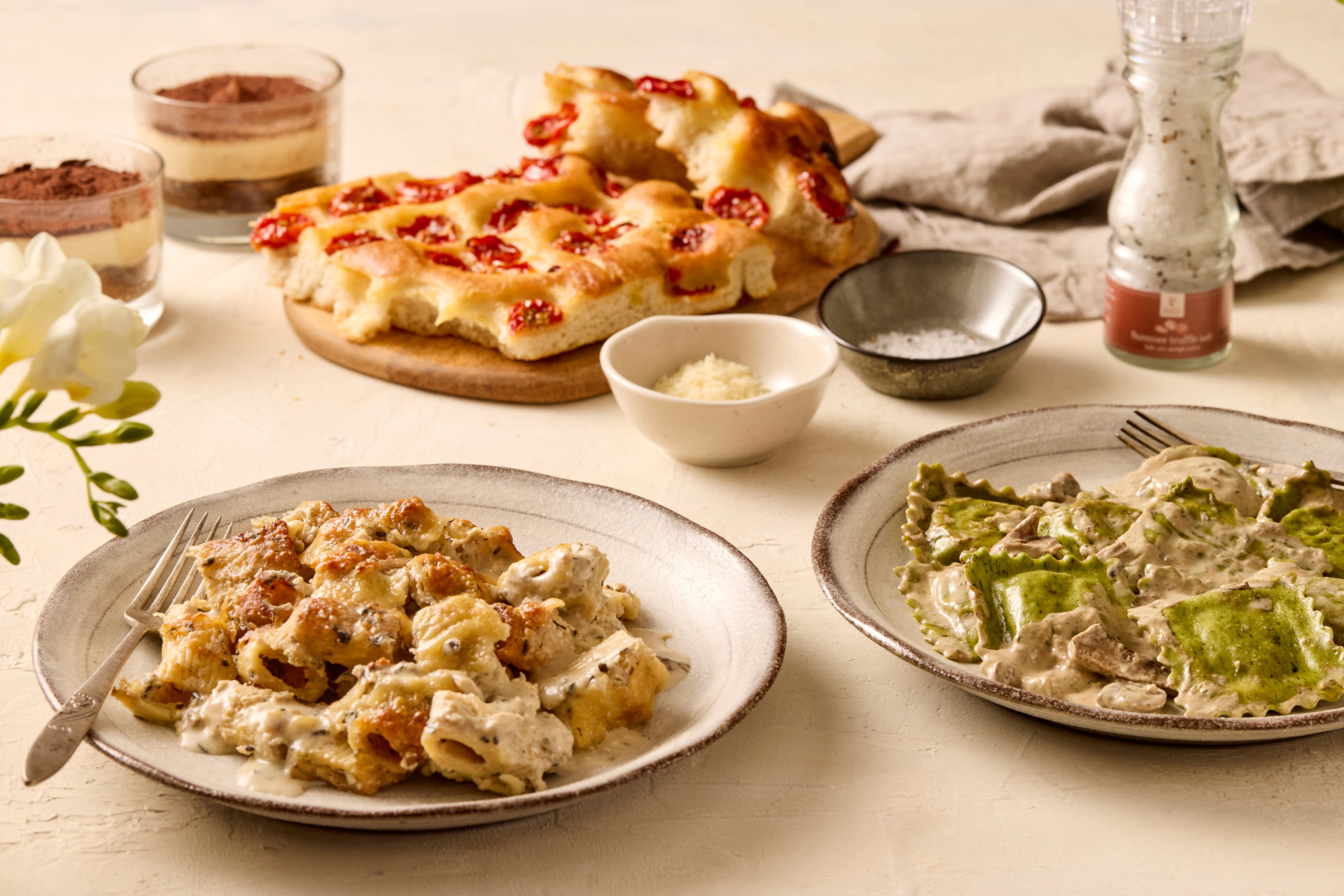 Plates of pasta, focaccia and tiramisu