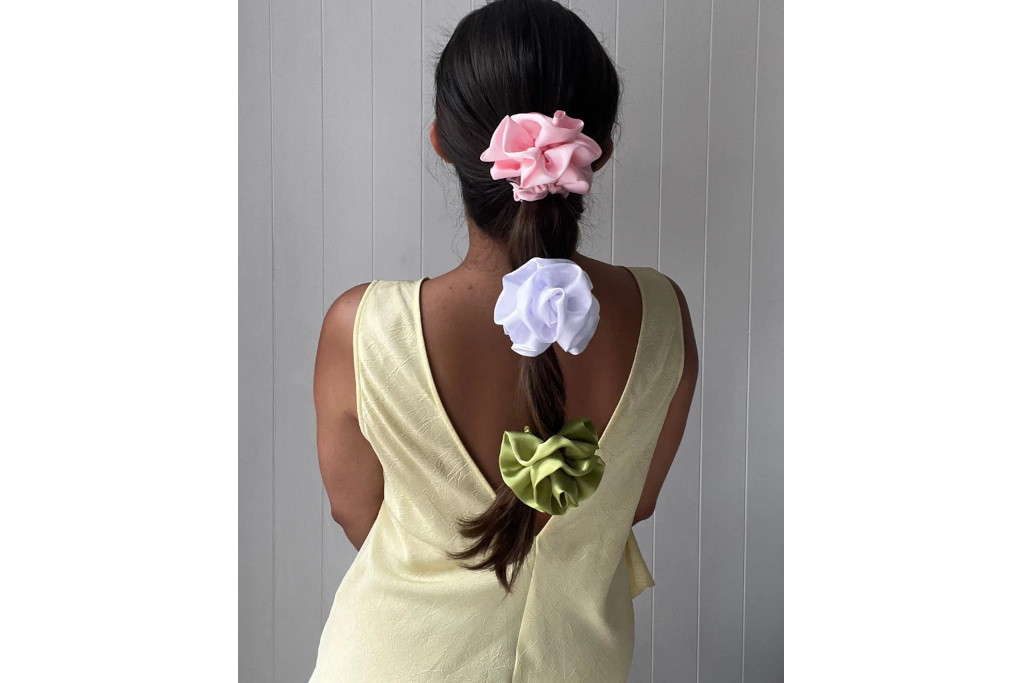 Girl's hair in a plait with corsage scrunchies