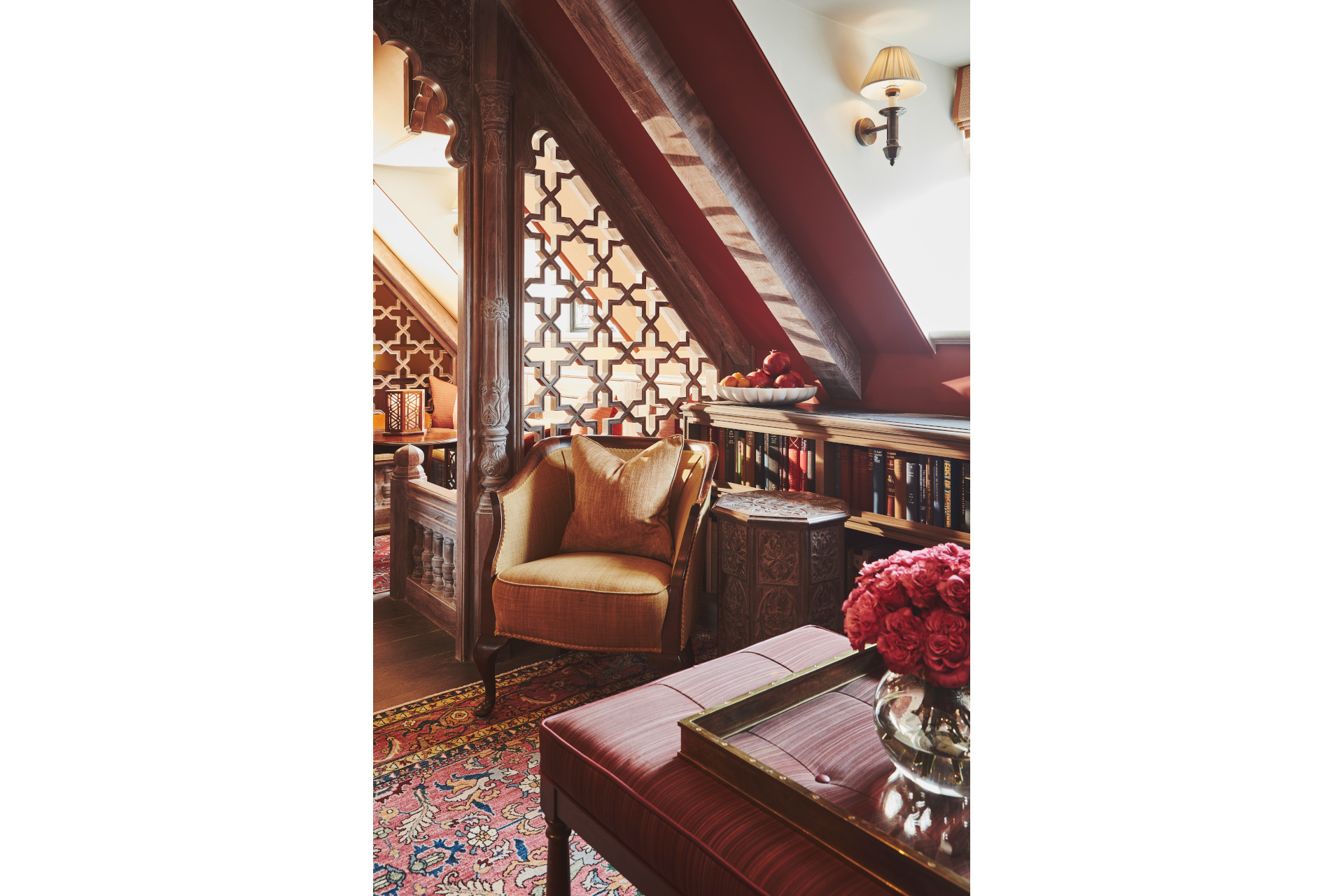 Cosy nook with armchiar and wooden carved screen